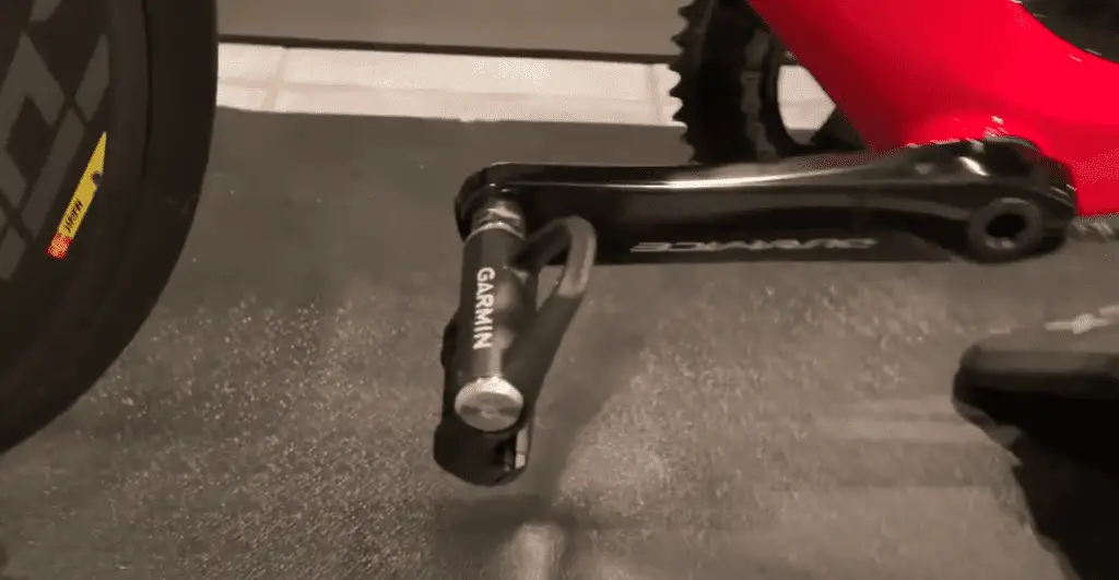 Garmin Vector 3 Pedal on a black crank shaft with red bike body