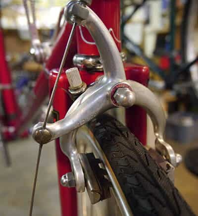 Front Brake pads on a red colored frame bike